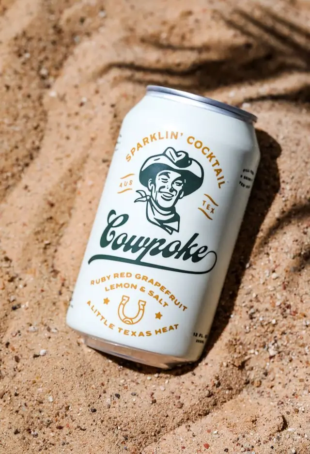 Cowpoke Sparklin' Cocktail — Ruby Red Grapefruit, Lemon & Salt can on sand