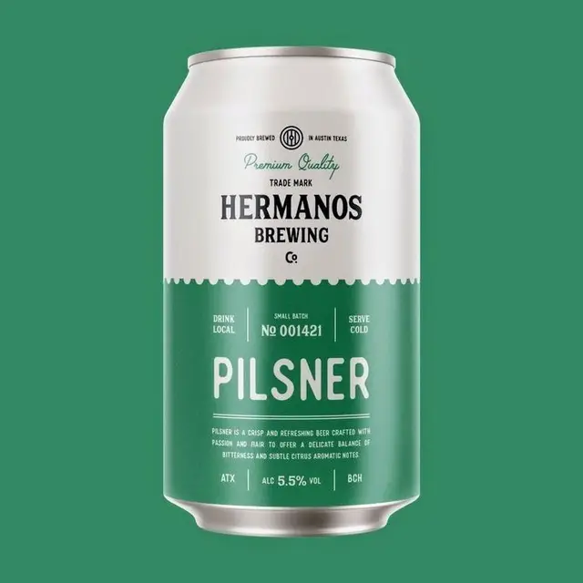 Hermanos Brewing Pilsner — white & green can with scalloped label