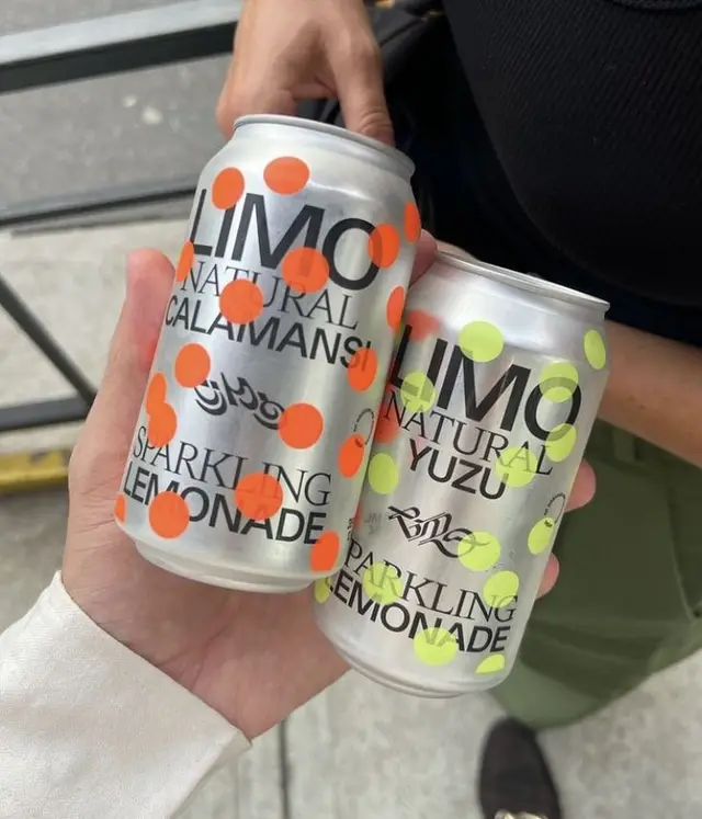 LIMO sparkling lemonade cans with neon polka-dot packaging
