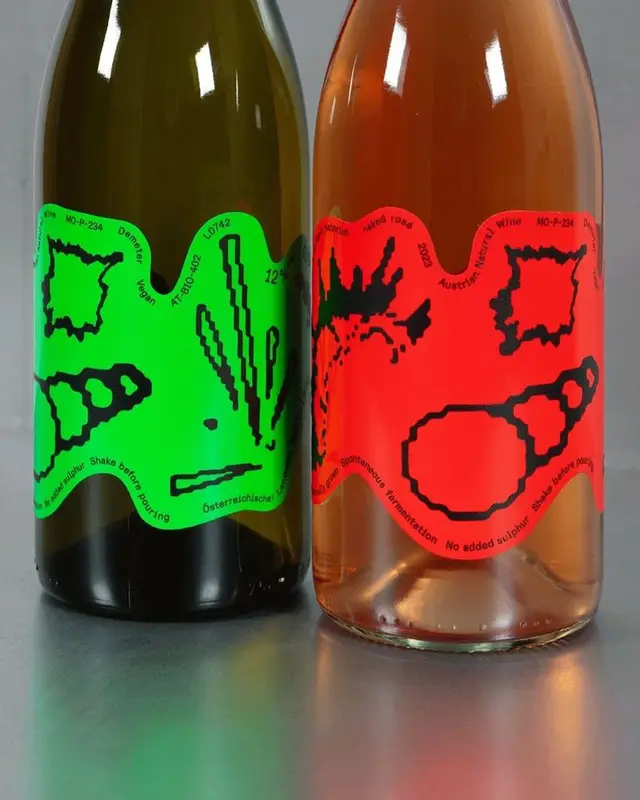 Neon-label natural wine bottles — green and red abstract graphic labels