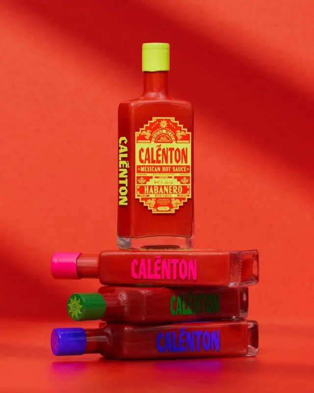 Calénton Habanero Mexican Hot Sauce — stacked rectangular bottles with neon caps