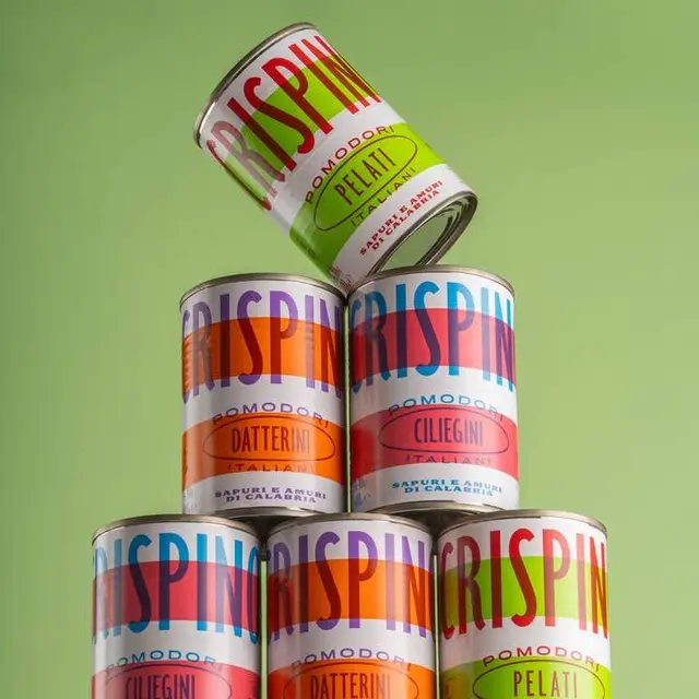 Stacked Italian canned tomatoes with colorful retro labels