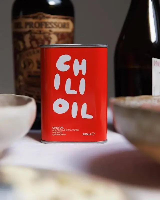 Red 250ml CHILI OIL tin with hand-drawn white lettering