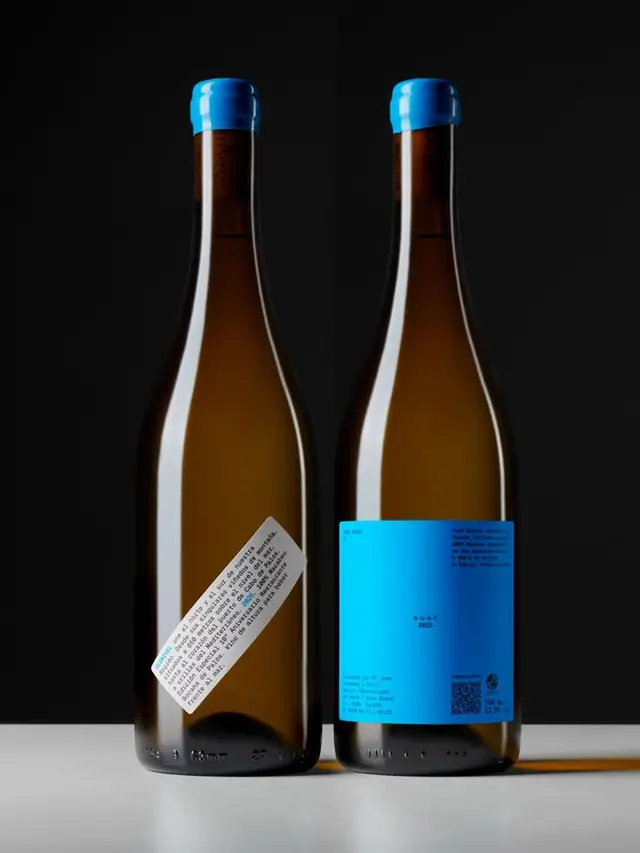 Minimal wine packaging — cyan label with blue wax capsule
