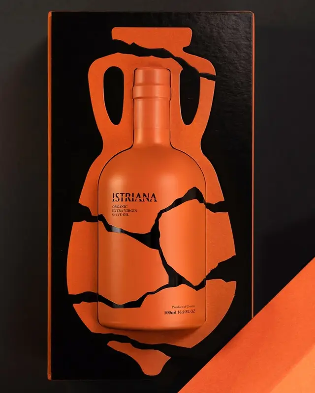 ISTRIANA orange bottle packaging with amphora die-cut and cracked pottery motif