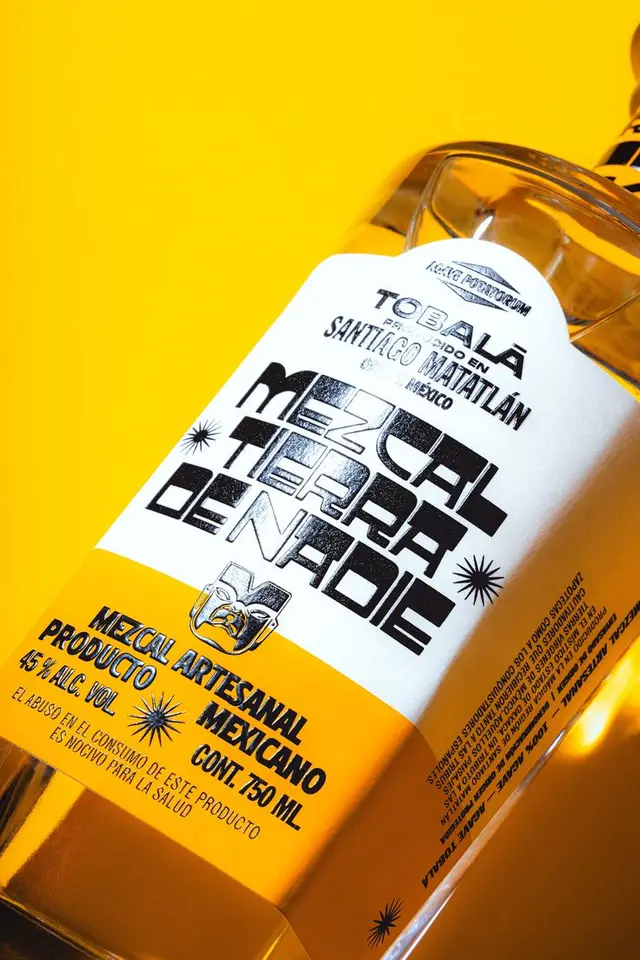 Tobalá mezcal 'Tierra de Nadie' — yellow‑labeled 750 ml bottle close-up