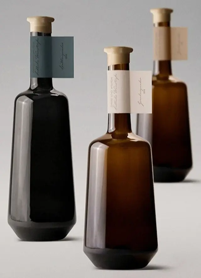 Minimalist Amber and Black Glass Bottles with Neck Tags