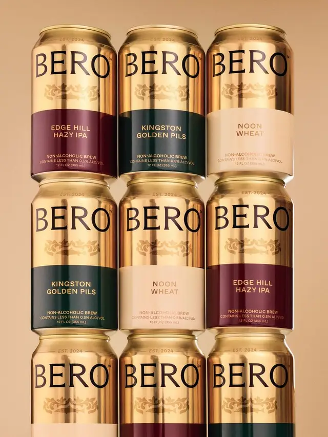 BERO non‑alcoholic beer cans — gold metallic packaging with color‑coded bands