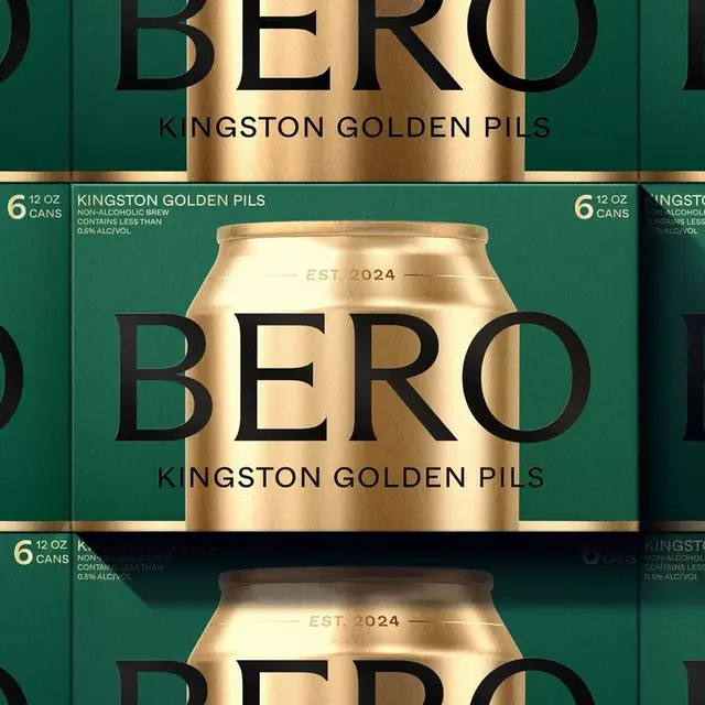 Emerald six-pack sleeve with metallic gold can — Kingston Golden Pils packaging
