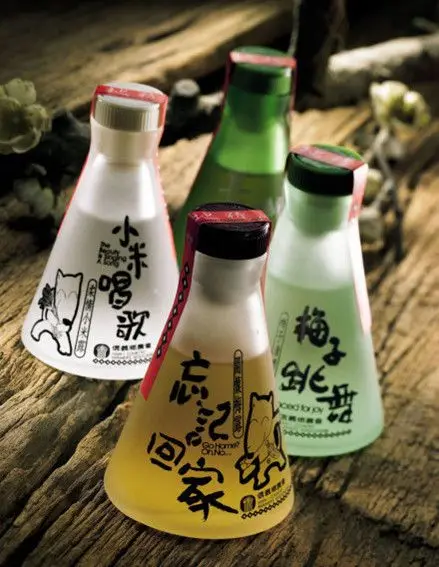 Frosted conical beverage bottles with calligraphic Chinese labels and cat illustration