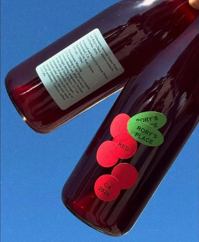 Dark glass red wine bottles with circular sticker labels — "RORY'S PLACE"