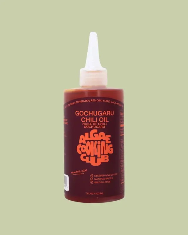 Gochugaru Chili Oil squeeze bottle with orange 'ALGAE COOKING CLUB' label