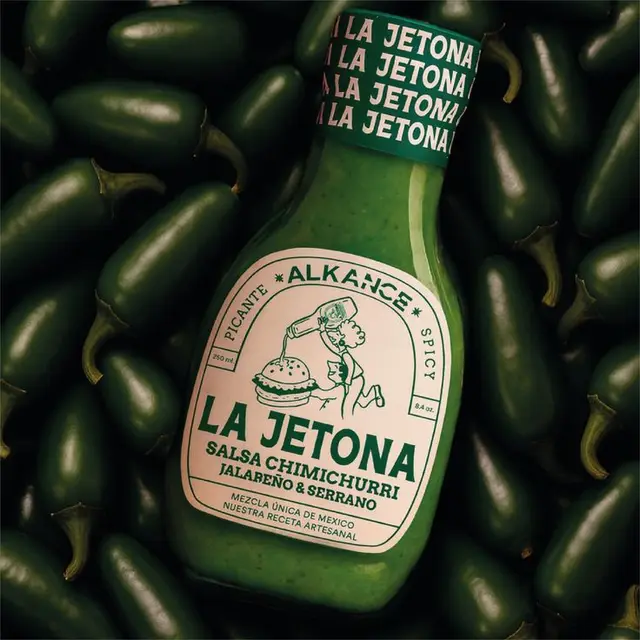 La Jetona salsa chimichurri bottle on bed of jalapeños
