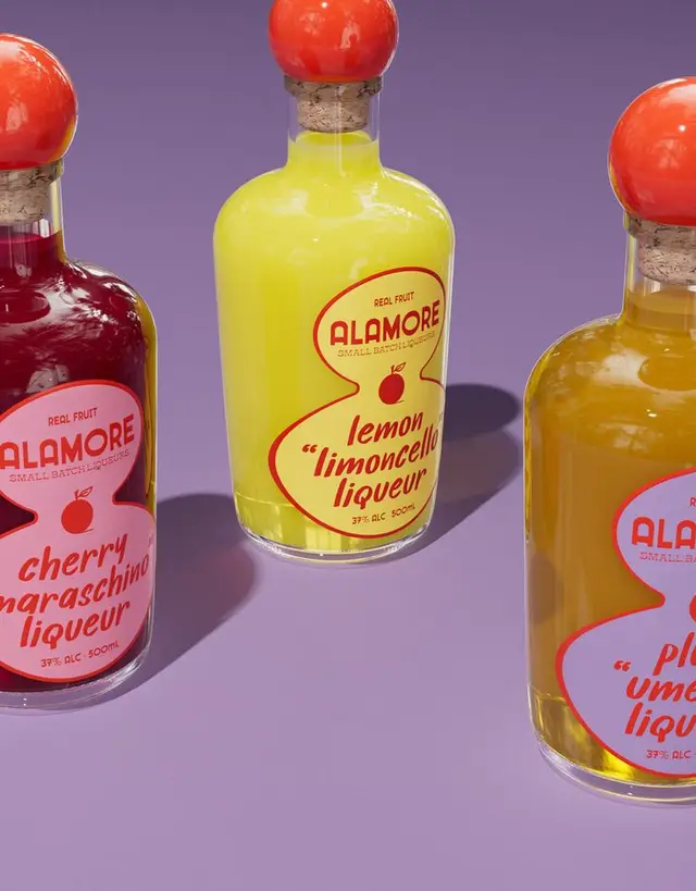 Alamore lemon limoncello liqueur bottle — bright studio product shot
