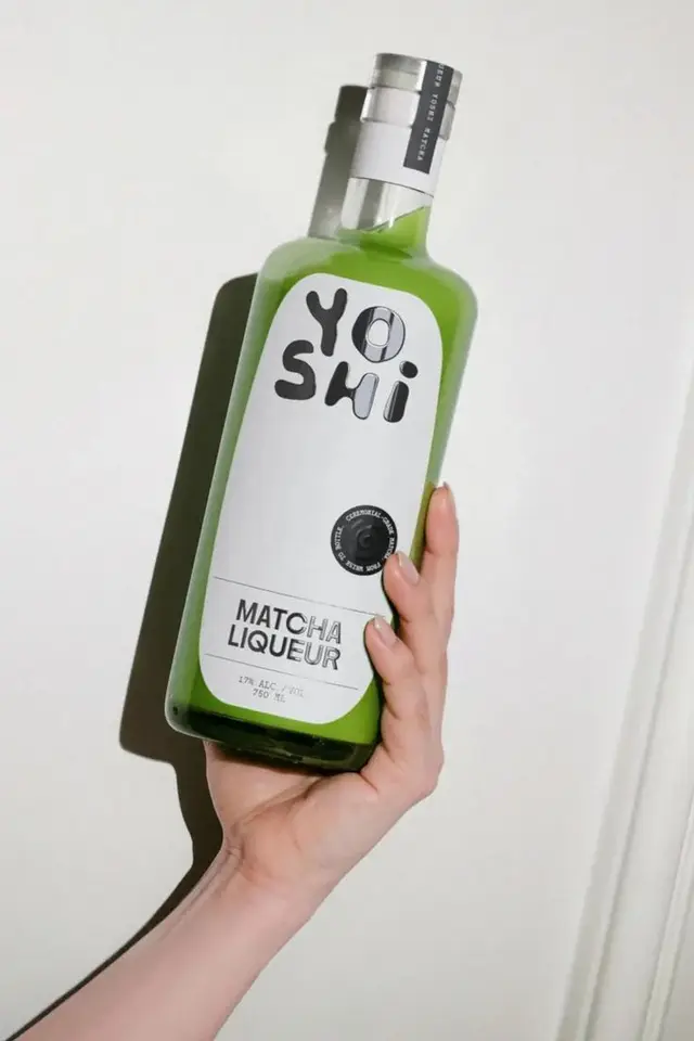 Yoshi Matcha Liqueur — green glass bottle with minimalist white label