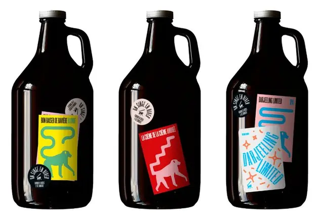Three dark glass growlers with bold graphic animal labels
