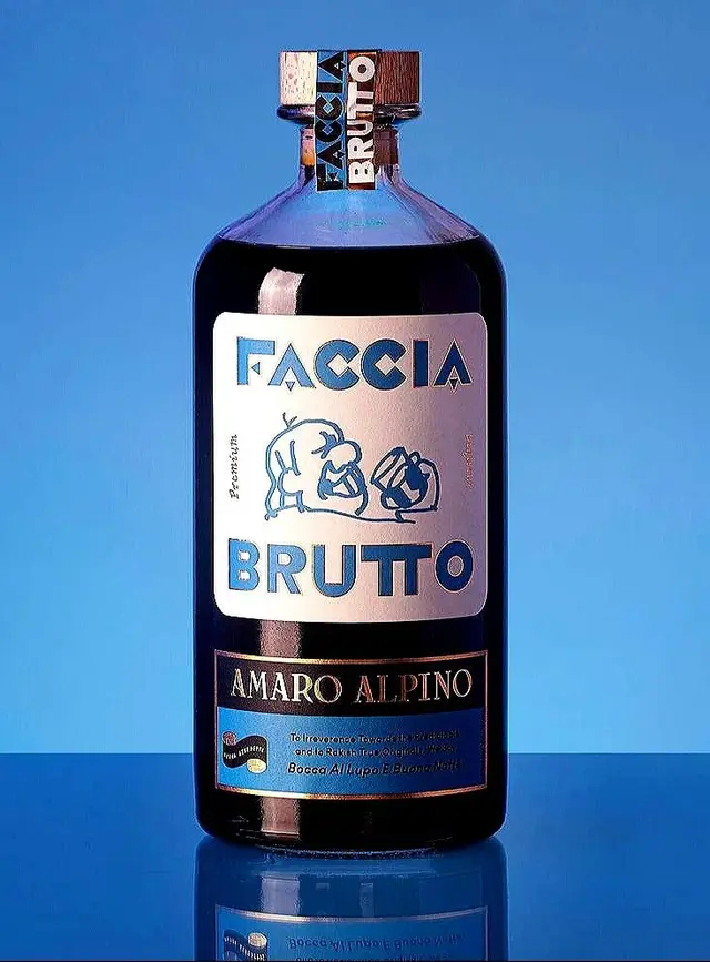 Faccia Brutto — Amaro Alpino bottle on blue studio background