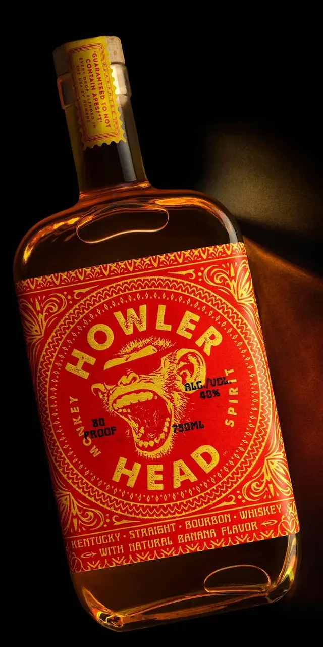 Howler Head bourbon bottle with red ornamental label and howling monkey