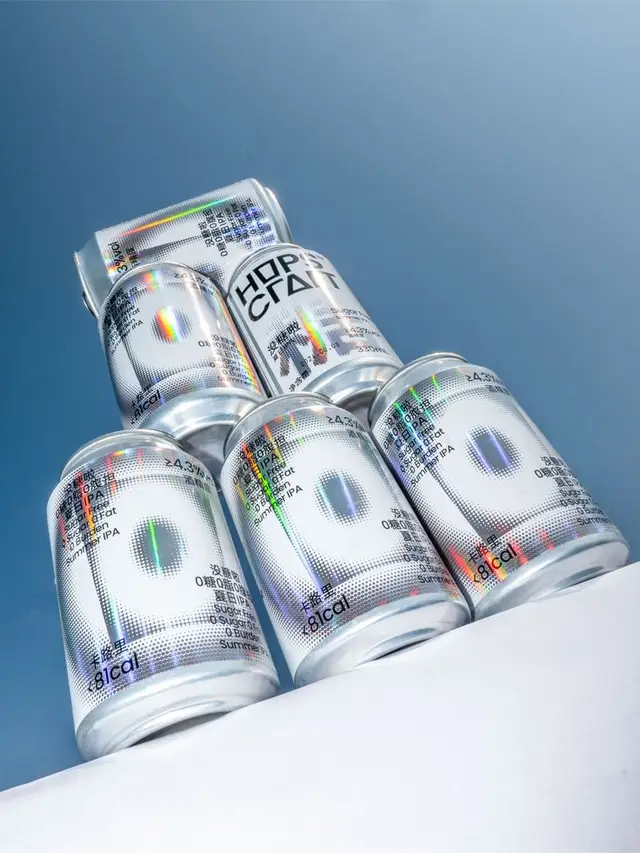 Holographic halftone IPA cans — stacked product shot