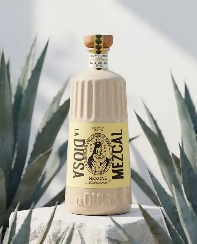 La Diosa Mezcal — cream ceramic bottle with yellow label and wooden stopper