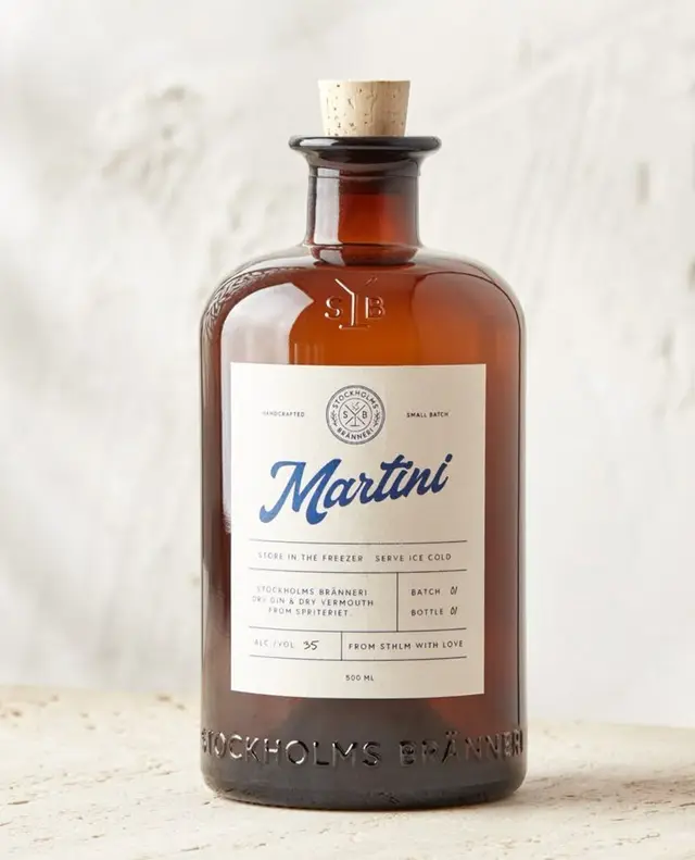 Amber apothecary-style Martini bottle with cork and cream label