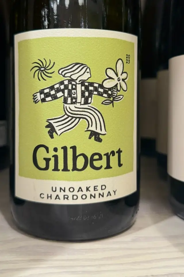 Gilbert Unoaked Chardonnay — green label with playful running figure