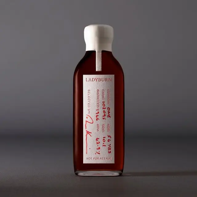 Ladyburn amber spirit bottle with white wax seal and handwritten label