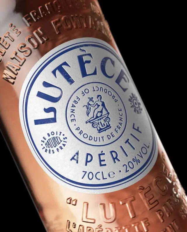 Lutèce Apéritif rosé — embossed glass bottle with circular blue label