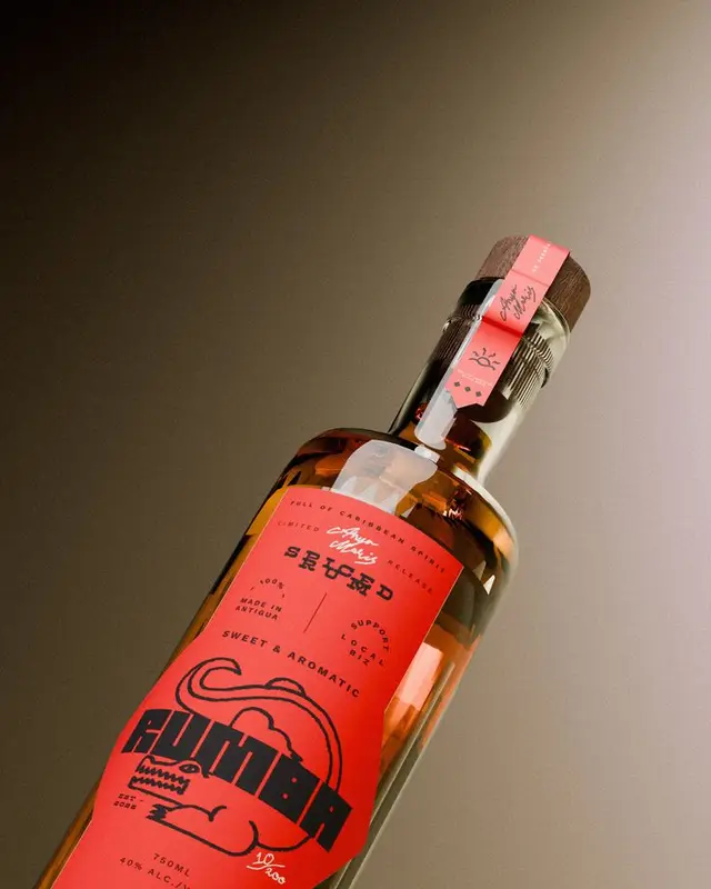 Spiced rum bottle with red illustrated label and wooden stopper