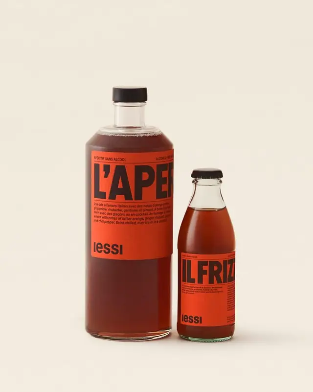 Lessi bottled aperitif — two glass bottles with red-orange labels