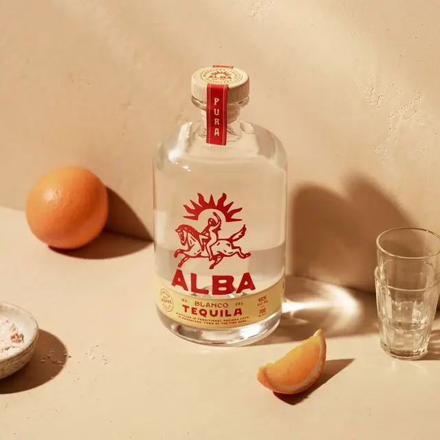ALBA Blanco tequila bottle with orange wedge and shot glass