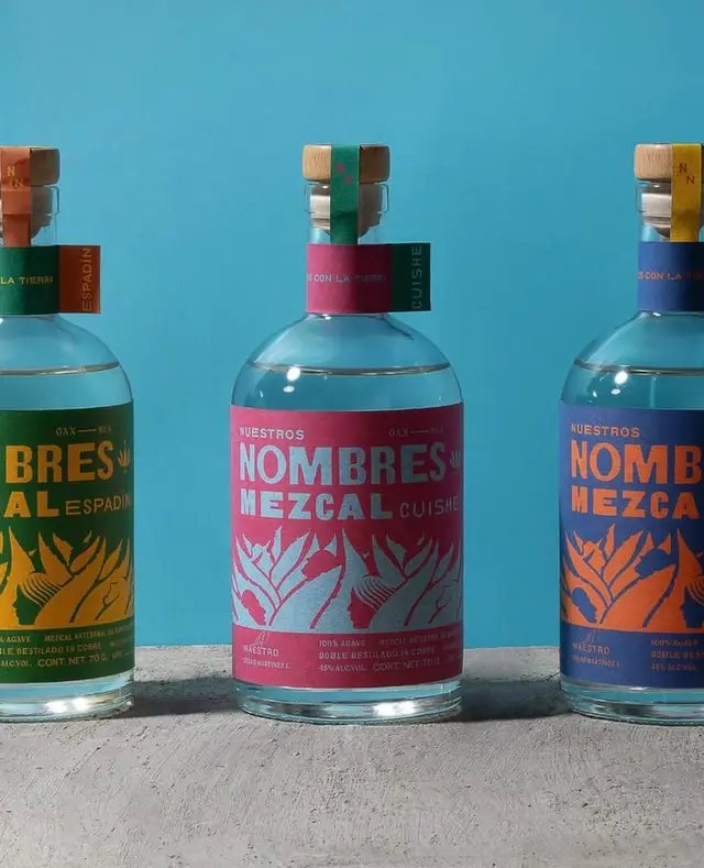 Nombres Mezcal — three glass bottles with colorful typographic labels