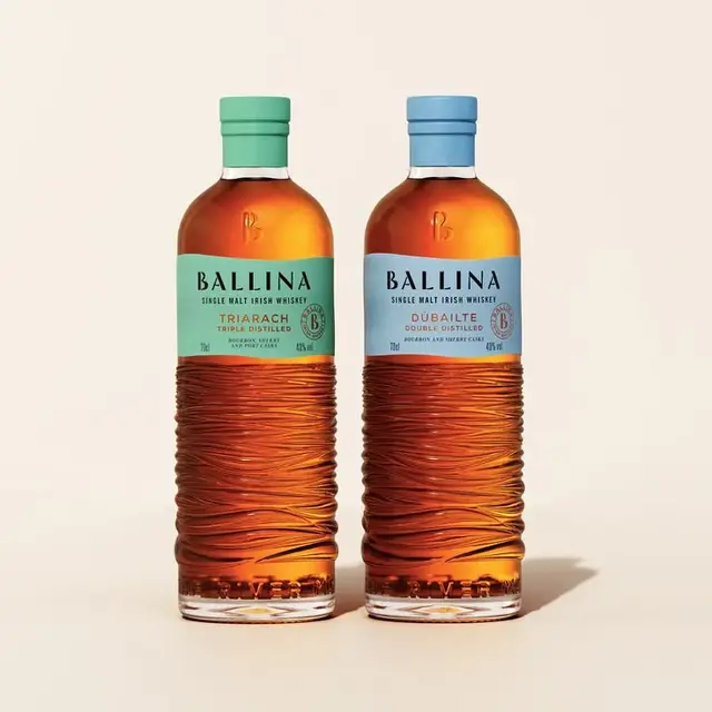 Ballina single malt Irish whiskey — two textured glass bottles with pastel labels