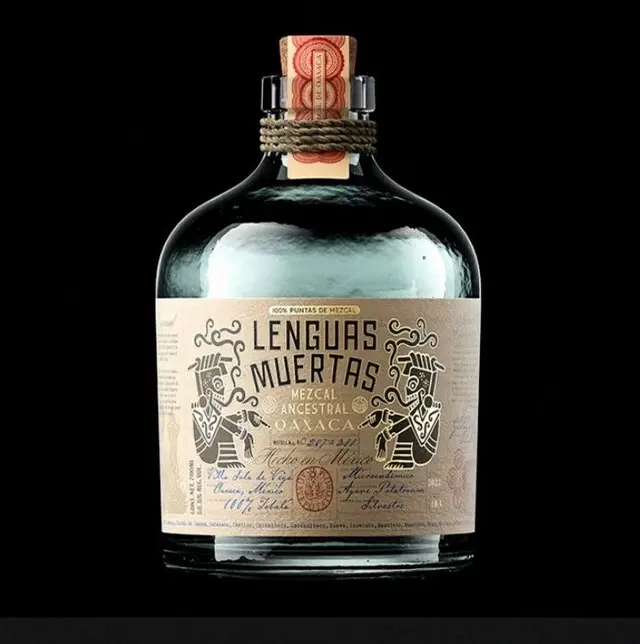 Lenguas Muertas mezcal bottle — Oaxaca ancestral mezcal with illustrated paper label