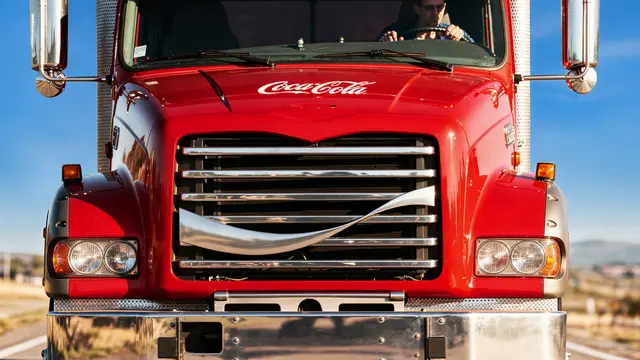 Coca‑Cola red delivery truck — front view with chrome grille and script logo