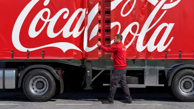Coca-Cola curtain-side delivery truck with stacked beverage cases