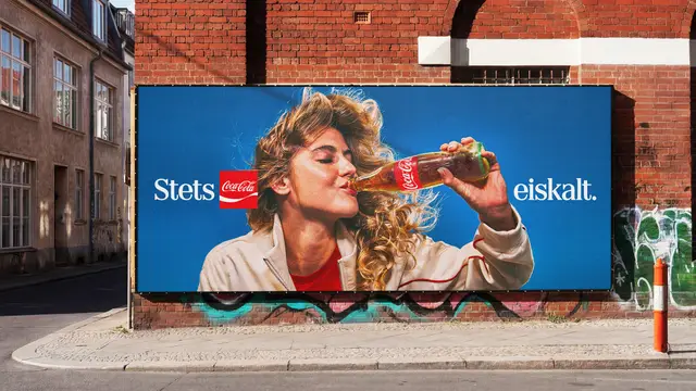 Coca‑Cola billboard — woman drinking from glass bottle, blue background, German copy