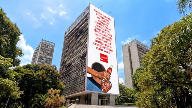 Coca‑Cola vertical billboard on high‑rise in Brazil