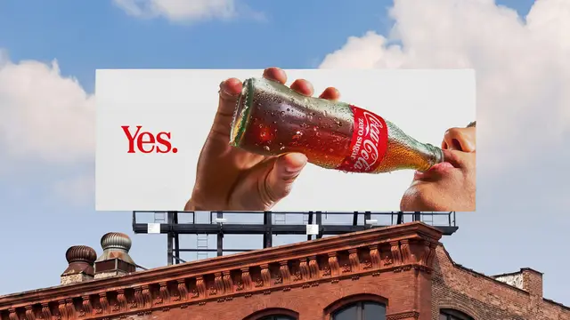 Coca-Cola billboard close-up: glass bottle with 'Yes.' copy