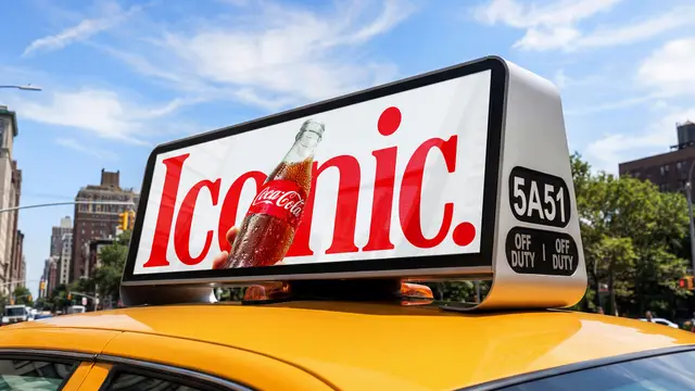 Coca-Cola "Iconic." rooftop ad on yellow taxi