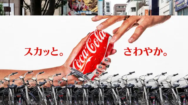 Coca‑Cola Tokyo billboard — hands passing red can above parked bicycles