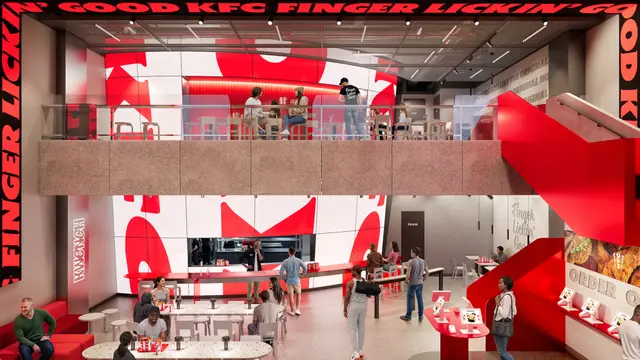 KFC 2026 concept — two-level red-and-white restaurant interior with sculptural staircase