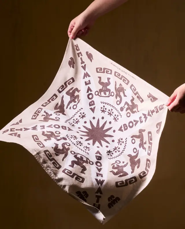 Cream cotton bandana with brown sunburst and Aztec-inspired print
