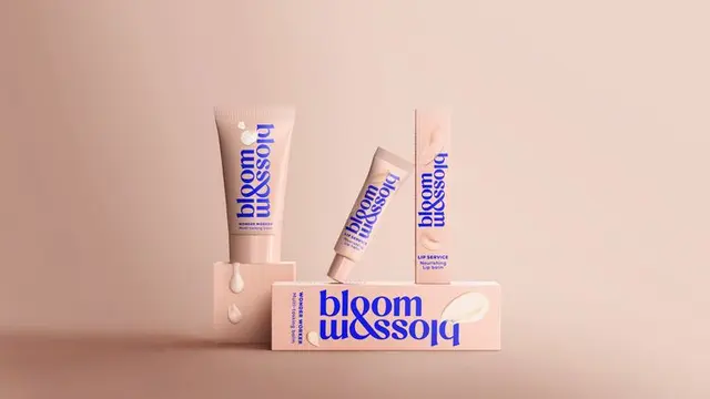 Bloom and Blossom packaging flat‑lay with bold blue logotype