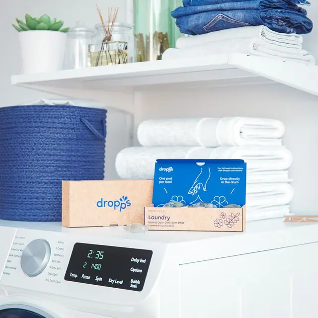 Dropps kraft cardboard boxes with blue-green geometric pattern and dissolvable pods