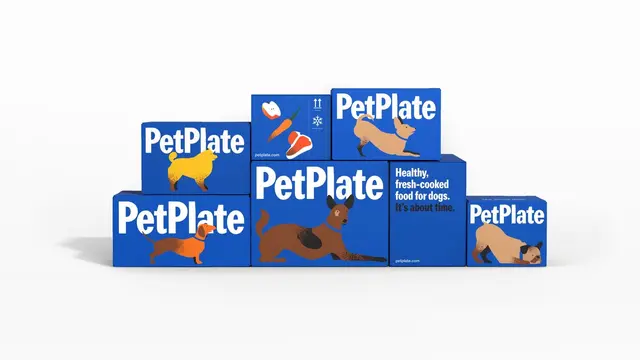 PetPlate packaging — cobalt-blue boxes with flat dog illustrations