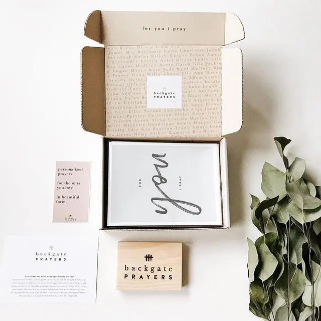 Backgate Prayers — open mailer box with greeting card and wooden stamp