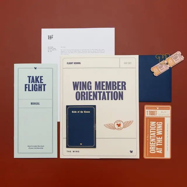 The Wing — Wing Member Orientation print packet flat lay