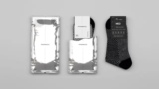 Pharmacie Goods sock subscription — reflective foil mailer and minimal paper banding