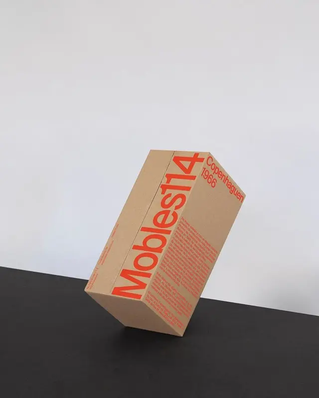 Mobles114 kraft cardboard packaging with bold red typography